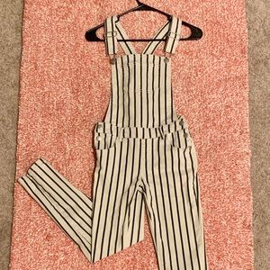 White and navy blue striped overalls.